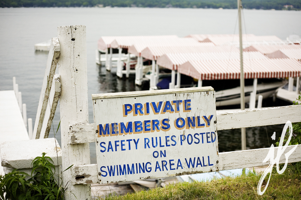 close up of private harbor sign saying private members only