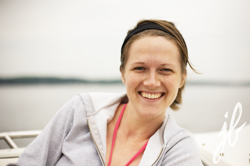 woman smiling on boat on lake geneva