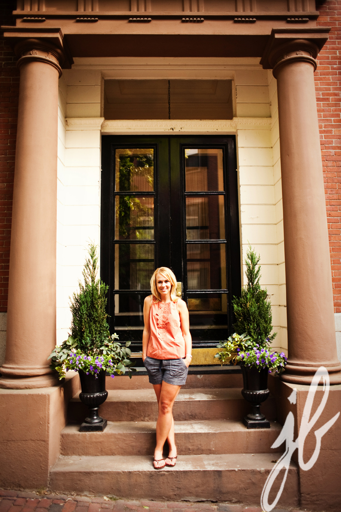woman posing on boston doorstep