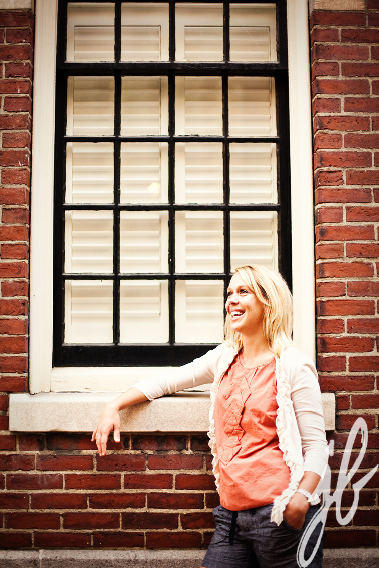 woman posing infront of a window in boston