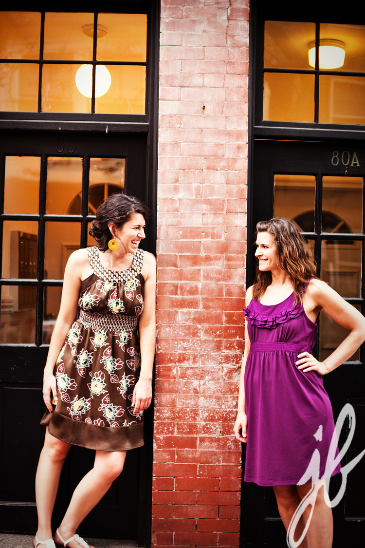 two women smiling at each other on a boston doorstep
